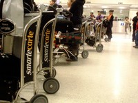 airport luggage carts_Flickr_confidence, comely