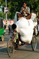 India biker with heavy load and passenger_Flickr_BriceFR