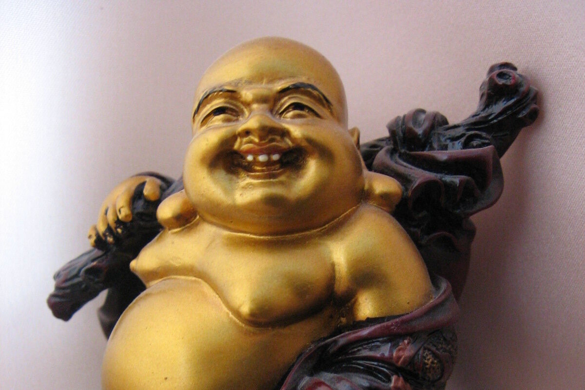 Golden statue of a smiling Buddha