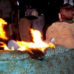 Man sitting on burning couch