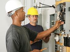 Two electricians working