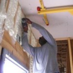 Person installing insulation