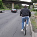 Bicyclist on street with no bike lane