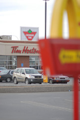 Strip mall parking lot with Tim Hortons coffee shop