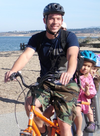 Dad and daughters biking in Monterey