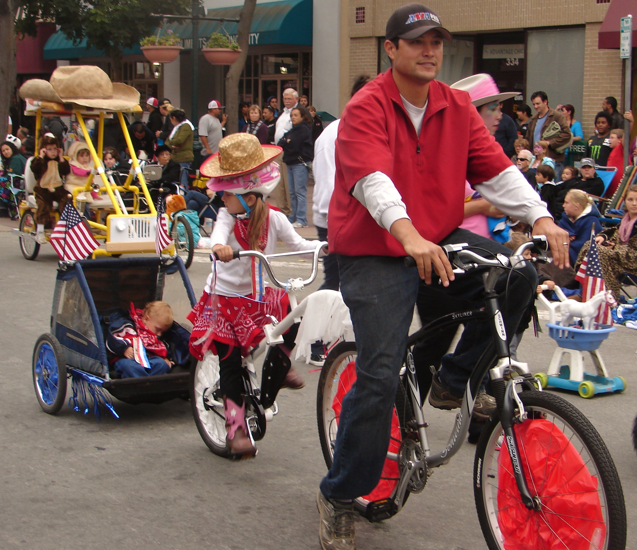 Dad, daughter, and son on bikes