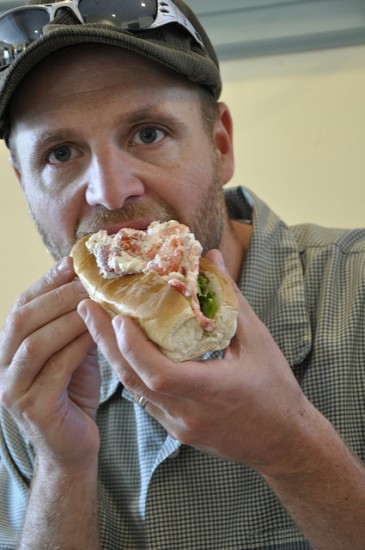 My husband Gus eating a lobster roll.