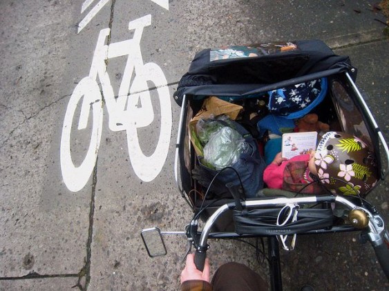 Bike lane and a trailer full of groceries and child. Courtesy: Patrick Barber.
