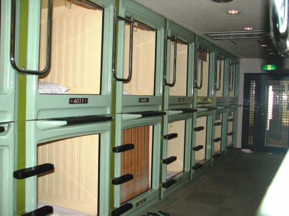 Rows of sleeping units at Asakusa capsule hotel in Japan.