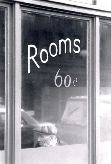 Window with sign reading "Rooms, 60 cents."
