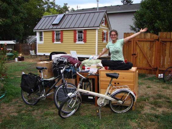 Lina Menard with her possessions, sitting outside a tiny home she lived in for 10 months.
