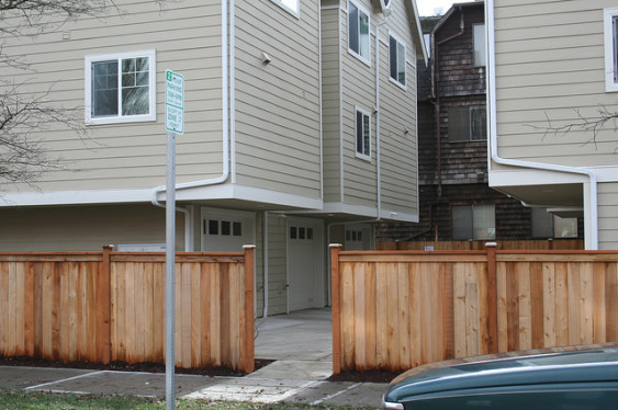 Townhouses with a parking-court style entrance to garages.