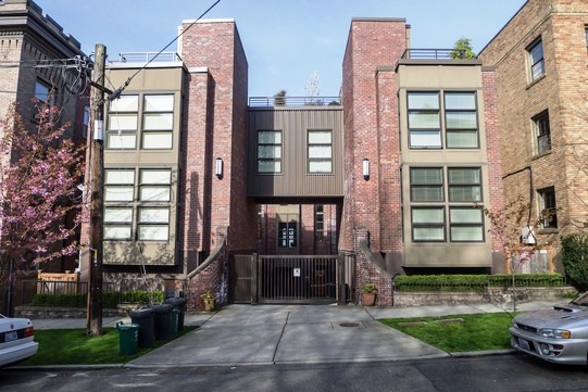 A driveway gate is the only entrance to this apartment building.