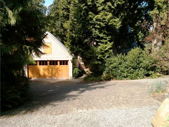 A required two-car garage dominates a single-family lot.