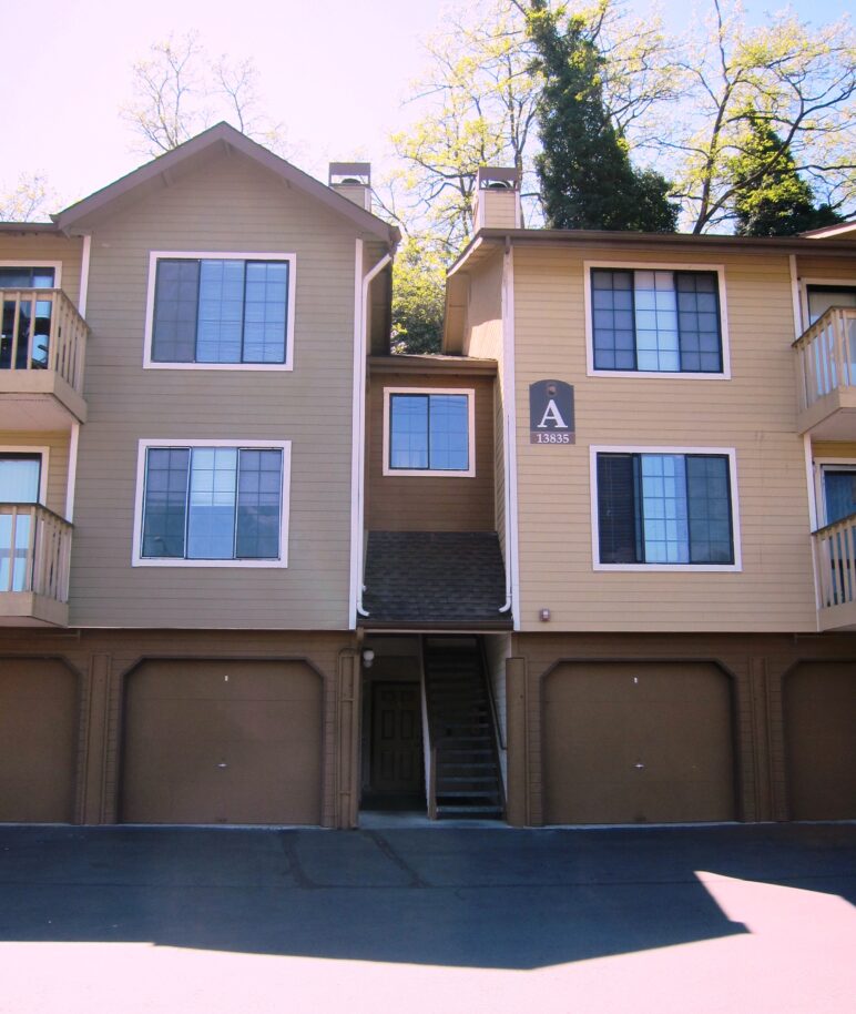 Ground level garages dominate the street entrance to these townhomes.