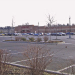 A department store in a mixed-use development still requires a large parking lot.
