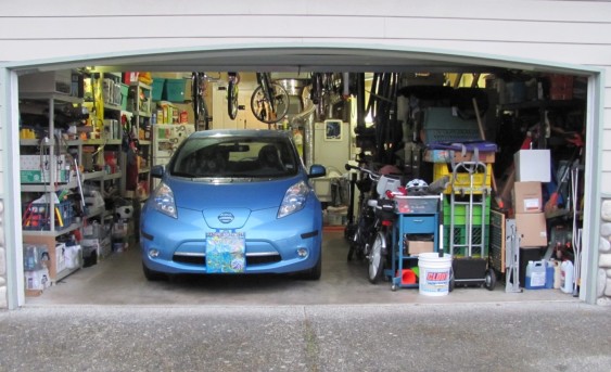 One car and lots of stuff in a two-car garage.