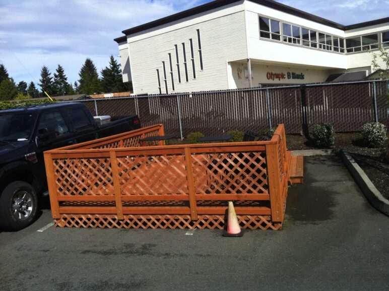 Two parking spaces converted to customer seating at a Taco Time.