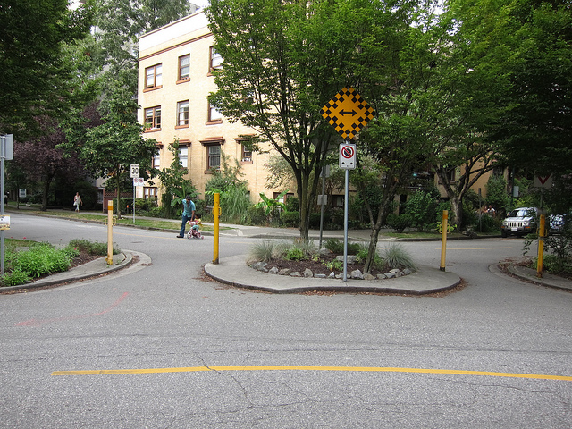 People walking or on bikes can go through this diverter, but cars cannot – limiting the traffic volumes on this West End bikeway. Photo by Alyse Nelson, used with permission.