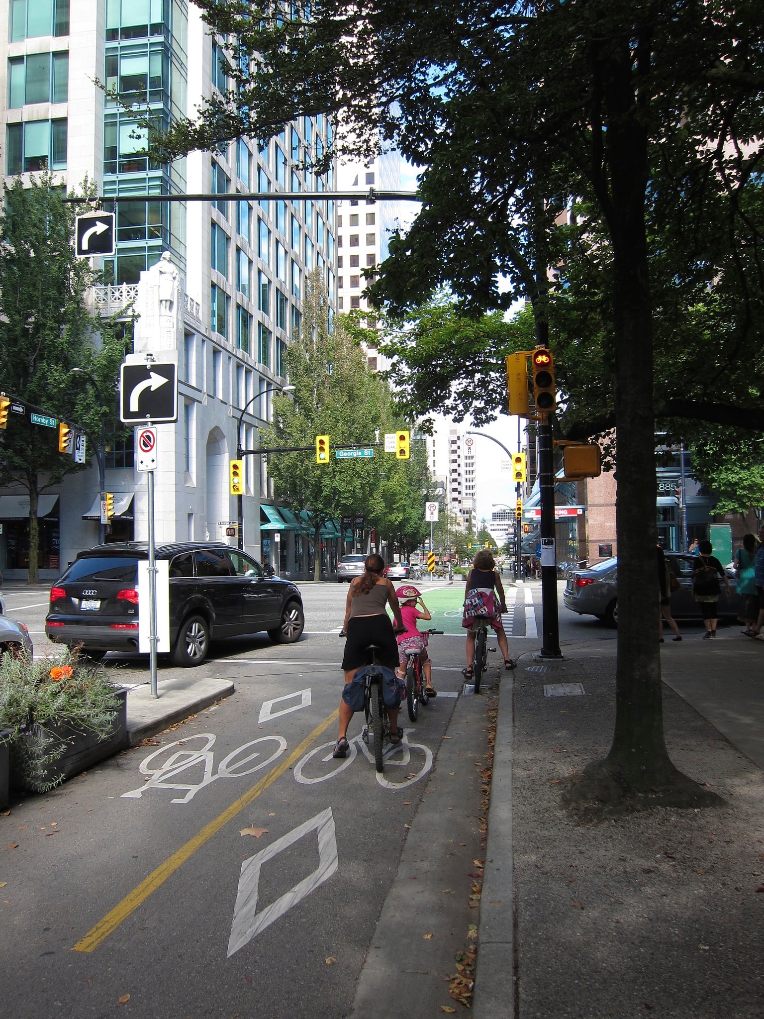 Some intersections have a separate right-turn signal cycle for vehicles where cyclists are stopped. Photo by Alyse Nelson, used with permission.