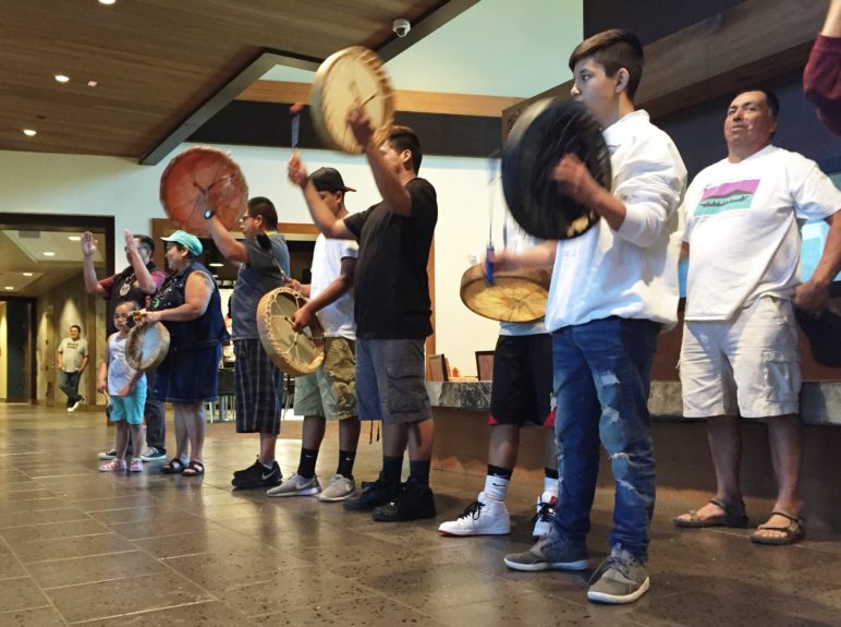 Lummi School students play traditional drums during a lunch the tribe hosted on Monday, May 9, at the Lummi Nation Administration Center to celebrate the U.S. Army Corps of Engineers' decision to reject a permit for a coal terminal at Cherry Point. Photo by Ralph Schwartz, all rights reserved.