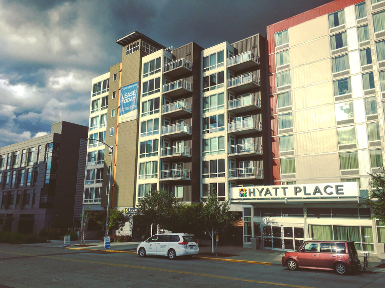 An example of how apartments and hotels compete for the same scarce urban land, the Hyatt Place hotel abuts the Anneliese apartments on the north edge of downtown Seattle, by Dan Bertolet, used with permission.