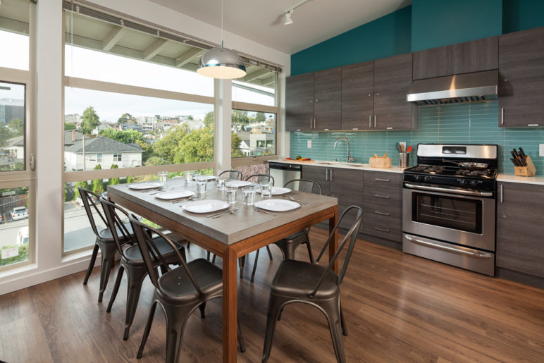 Yobi Apartments kitchen shared by floor, courtesy of Neiman Taber Architects.