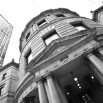 A black and white image of the entrance to Portland's city hall.