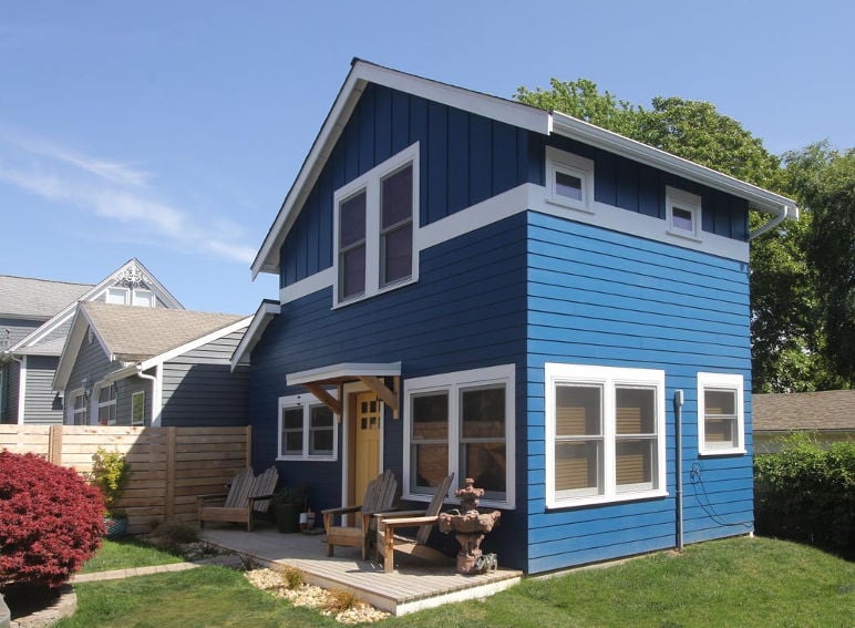A blue micro-house in a Seattle backyard