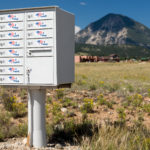 Rural mailboxes with "I voted" stickers on them.