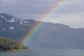 Alaskans vote for better elections, including ranked choice voting! Amazing nature’s view. Snowy mountains & beautiful rainbow touch on Alaska’s pretty landscape, with a rainbow!
