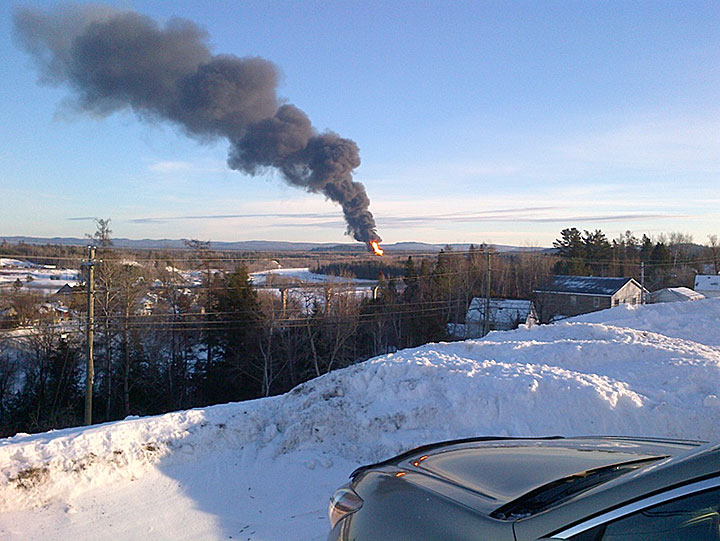 view of smoke from an oil train on fire