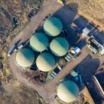 Aerial top down view over biogas plant.