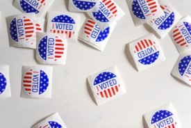 Scattered "I voted" stickers on a white background