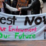 Banner at a rally: "Dives. Our endowment, our future."t now