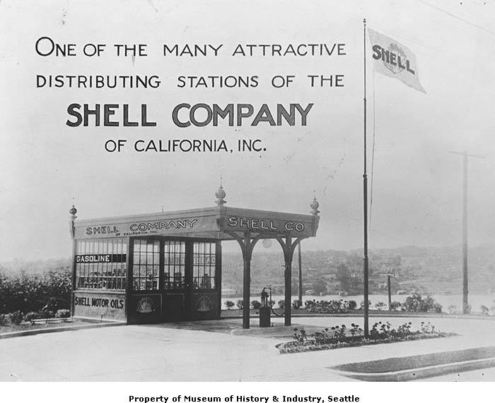 Black and white image of a Shell station in the 1920s with the following caption: "One of the many attractive distributing stations of the Shell Company of California, Inc."