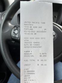 Photo of a receipt from the gas station, showing the final purchase price but not much else information