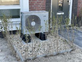 Photo of a heat pump outside for residential use