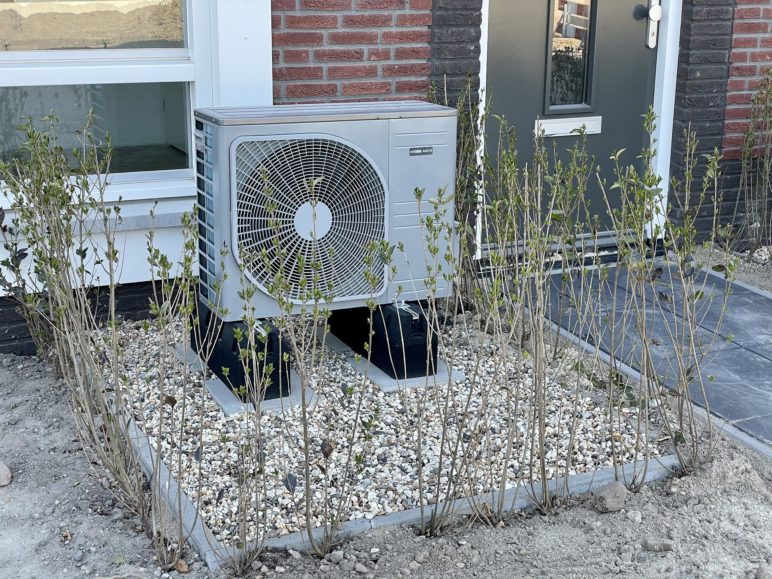 Photo of a heat pump outside for residential use
