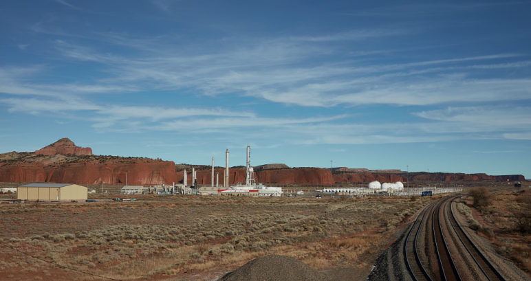 Landscape photo of a suspended refinery in New Mexico's desert landscape.
