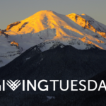 Giving Tuesday banner of snow capped mountains during Golden Hour