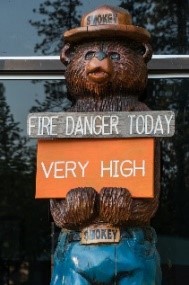 Smokey the Bear statue warning passersby of "Very High" fire danger (source: Oregon Department of Forestry).