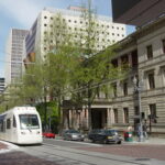 New MAX Light Rail in front of Portland, OR City Hall on a sunny day