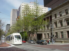 New MAX Light Rail in front of Portland, OR City Hall on a sunny day