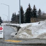 Photo of a sign directing to the Polling Place on a wet and snowky Alaska street
