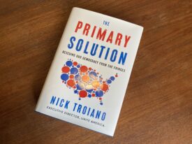 "The Primary Solution" by Nick Troiano book on a table