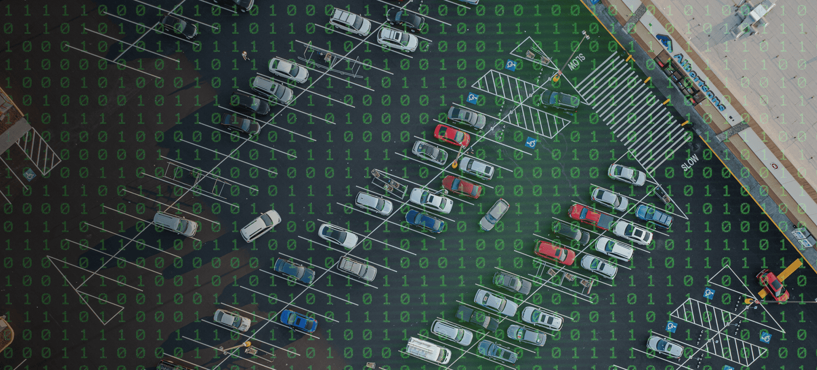 Aerial photo of a parking lot, but with a binary code overlay to imply cyber-ness.