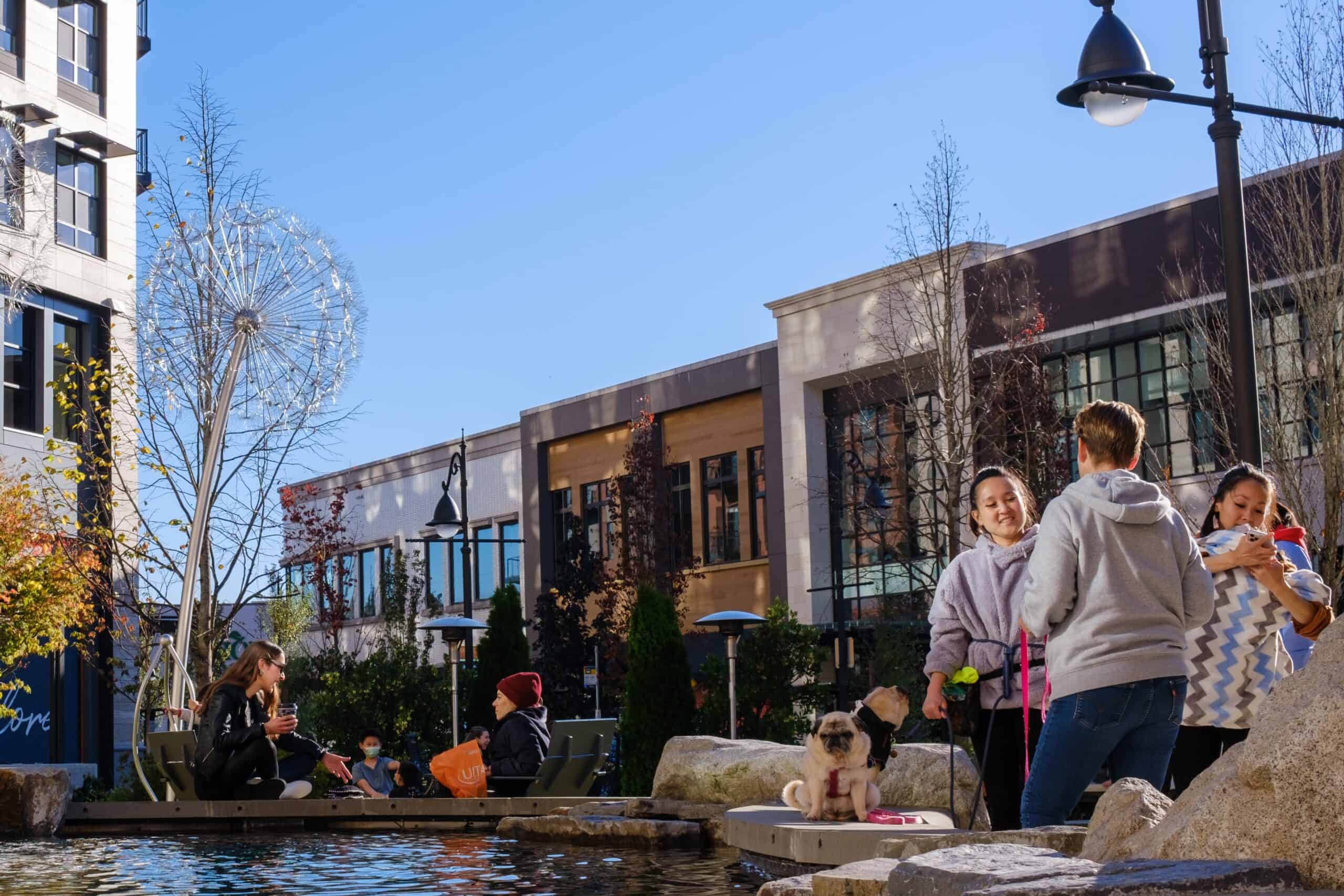 People enjoy outdoor seating in Totem Lake's "The Village" on a fall day in Kirkland, WA.