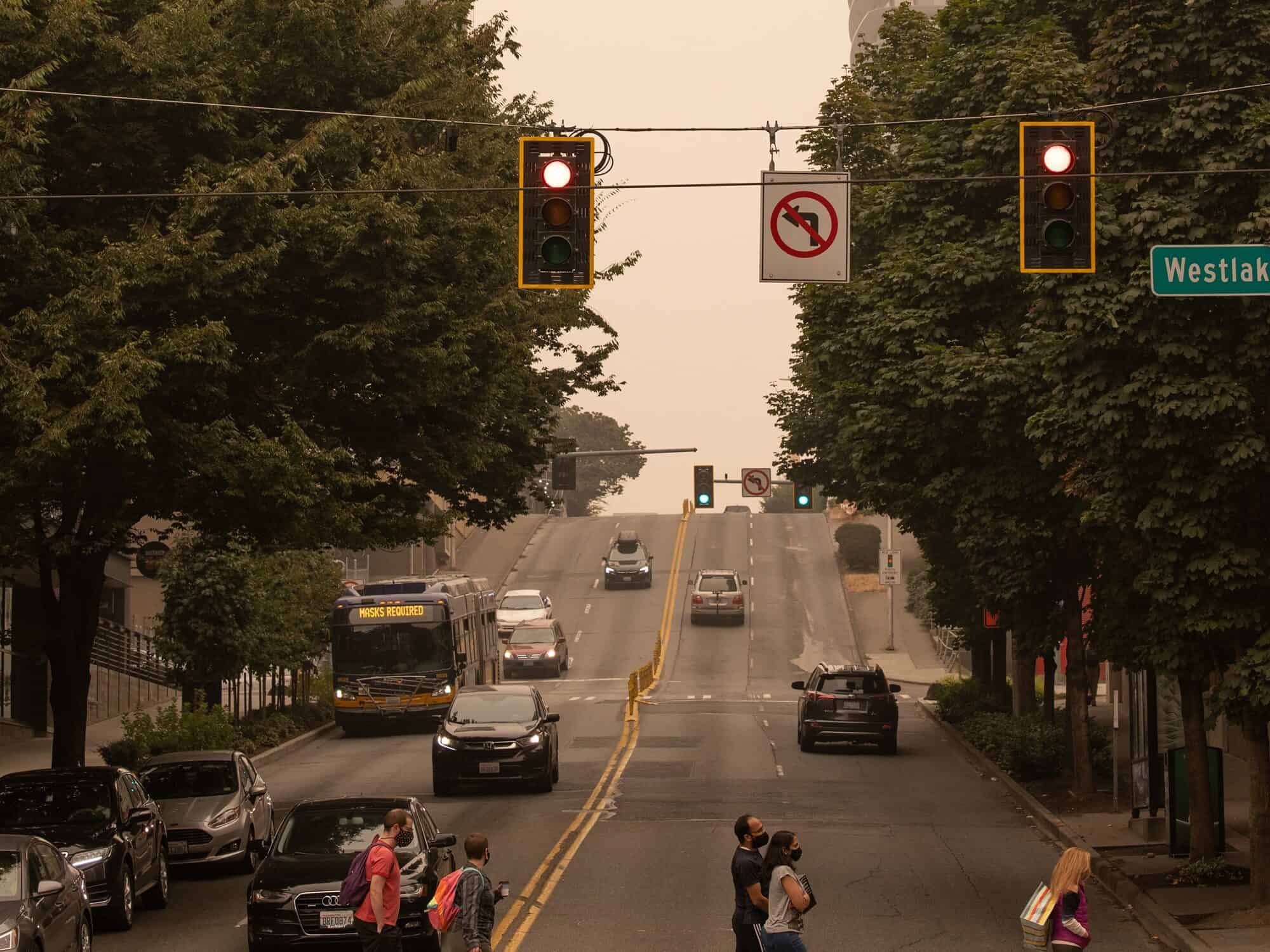 Pedestrians in Seattle wear face masks during smoke-shrouded days from regional wildfires, September 2020. Photo by Inna Zakharchenko.