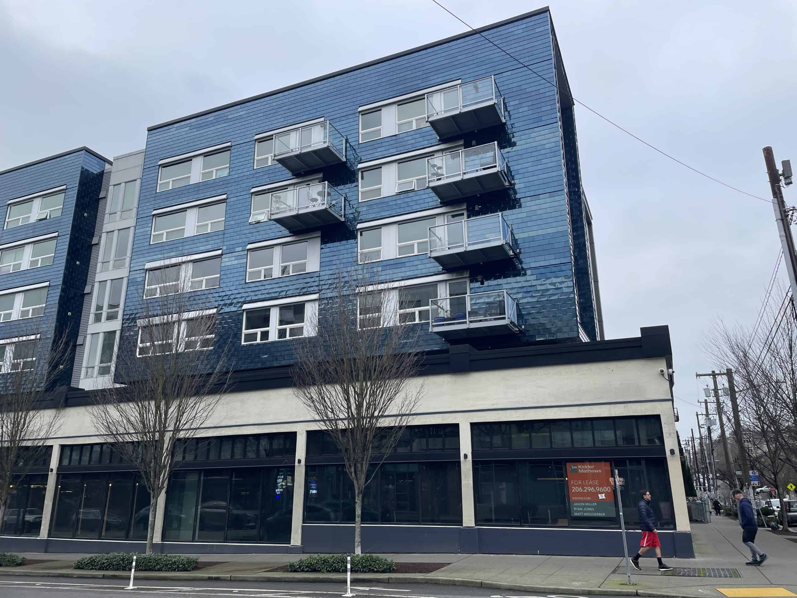 Empty ground-floor retail space at Pike and Harvard, in Seattle’s Capitol Hill neighborhood, where the average monthly rent for a two-bedroom apartment is over $2,700. Seattle’s ground-floor retail mandates have produced a glut even in the most densely populated neighborhood in Washington state. Photo by Dan Bertolet. 